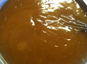 Mixture has taken on a rich, clear brown color.